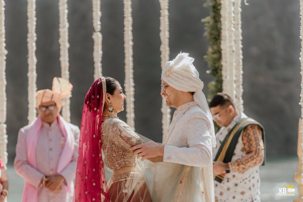 Smiling Couple on Jaimala Stage Captured by Wedding Photographers in Uttarakhand Best wedding Photography and cinematic wedding films in india videography