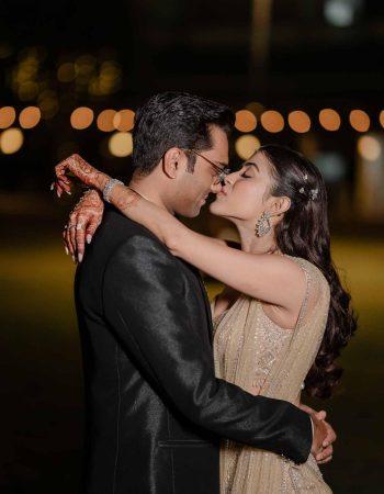 Groom wiping bride’s tears during candid wedding photography in Mumbai