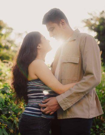 Couple posing at Tincha Falls during golden hour