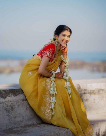 Wedding photographer in Indore capturing a joyful bride smiling during her bridal portrait session