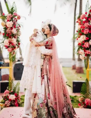 Indian wedding photography in Gurugram featuring bride and groom exchanging garlands during emotional Jaimala ceremony