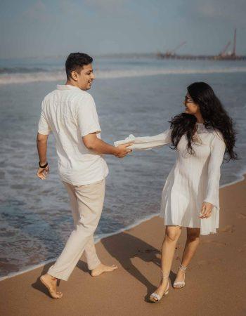 Couple posing during a pre wedding photoshoot on a Goa beach at sunset, photographed by KB Studio Production