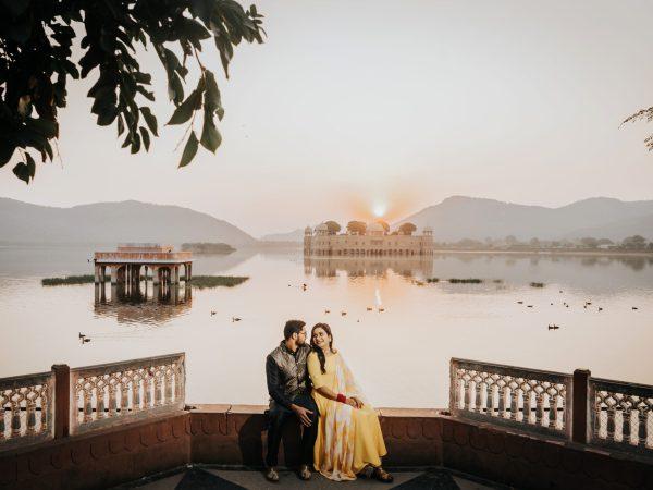 Cinematic Pre Wedding Photography in Jaipur | Jal Mahal Shoot Couple posing in traditional outfits during a pre wedding shoot at Jal Mahal Jaipur