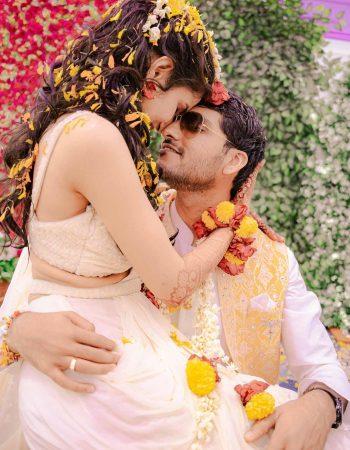 wedding photographer in Indore capturing bride and groom at Rajwada Palace with traditional attire and royal backdrop