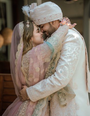 Bride and groom hugging and smiling joyfully, captured by wedding photographers in Gurugram