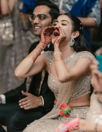 Wedding photography in Jaipur showing bride having fun during her engagement party at a royal venue